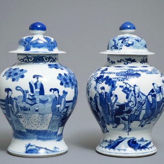 Two Chinese blue and white vases and covers with figures, 19th C.