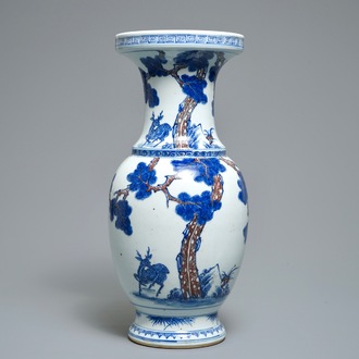 A Chinese blue, white and iron red vase with deer, 19/20th C.