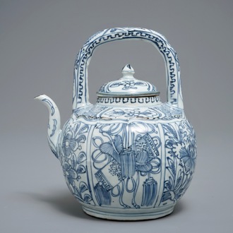 A Chinese blue and white kraak porcelain wine jug and cover with precious objects and flowers, Wanli