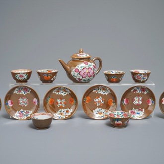 A Chinese famille rose capucin-ground teapot and six cups and saucers, Qianlong