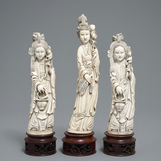 Three Chinese carved ivory figures of ladies on wooden stands, 2nd half 19th C.