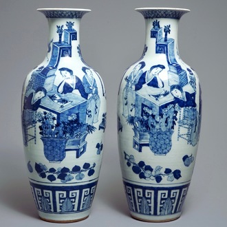 A pair of Chinese blue and white vases with ladies at a table, 19th C.