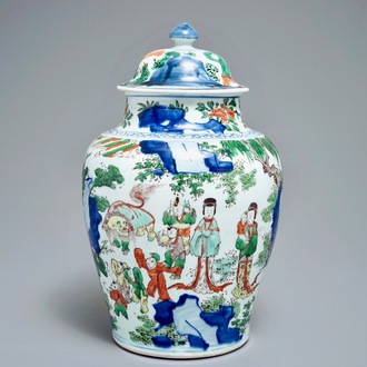 A Chinese wucai baluster vase and cover with figures in a landscape, Transitional period