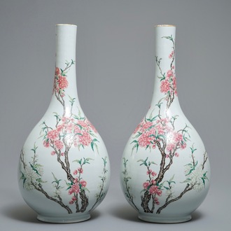 A pair of large Chinese famille rose bottle vases with floral design, 19/20th C.