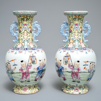 A pair of Chinese famille rose vases with playing boys, Qianlong mark, Republic, 20th C.