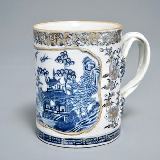 A Chinese blue, white and gilt tankard with relief design and twisted handle, Qianlong