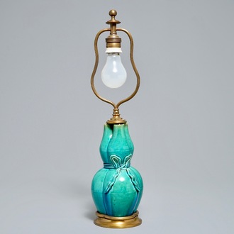 A Chinese turquoise-glazed three-spouted vase with bronze lamp mounts, 19th C.
