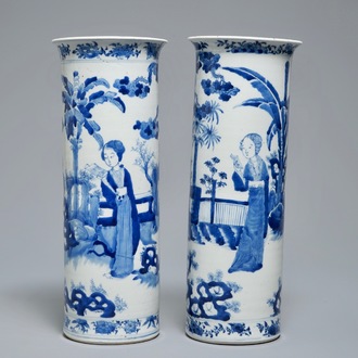 Two Chinese blue and white sleeve vases with ladies in a garden, 19th C.