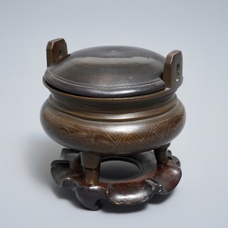 A Chinese silver-inlaid bronze incense burner on stand, 19th C.