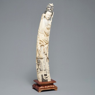 A tall Chinese carved ivory figure of a lady, 2nd half 19th C.