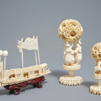 A Chinese carved ivory model of a junk and two Canton puzzle balls, 19/20th C.