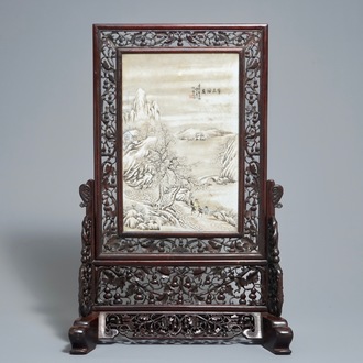 A Chinese carved wood table screen with a porcelain winter landscape plaque after He Xuren, 20th C.