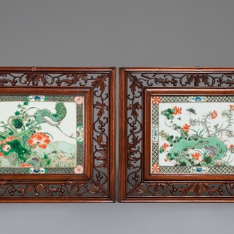 Two Chinese famille verte plaques in openworked wooden frames, 19/20th C.