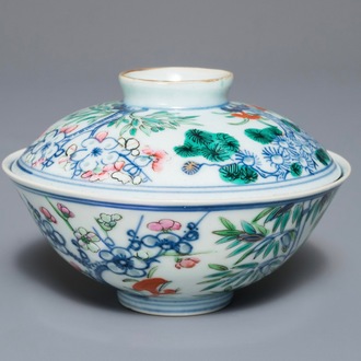 A Chinese famille rose bowl and cover with floral design, Qianlong mark, 19/20th C.