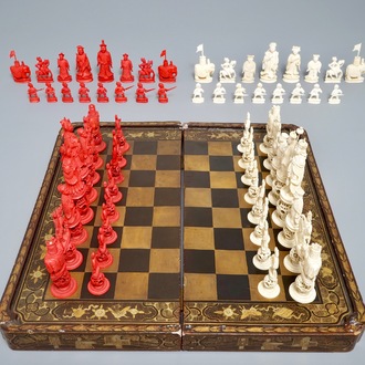 A Chinese lacquered chess and backgammon board with ivory chessmen, 19th C.