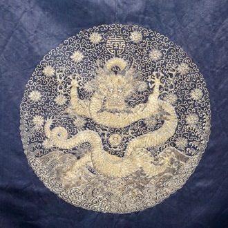 A blue-ground silk coat composed of Imperial Chinese gold thread dragon badges, 19th C.