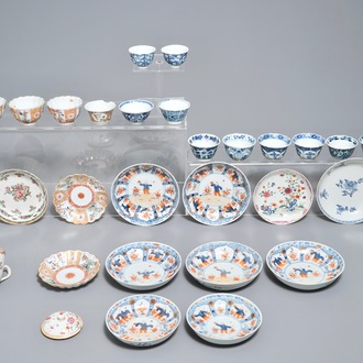 A collection of Chinese famille rose, verte and blue and white cups and saucers, Kangxi/Qianlong