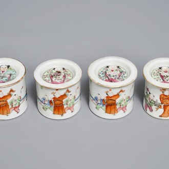 Four cylindrical Chinese famille rose covered boxes, 19th C.