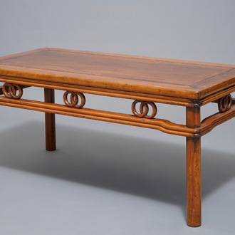 A Chinese wooden rectangular low table, 19th C.