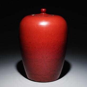 A Chinese monochrome oxblood-glazed jar and cover, 19th C.