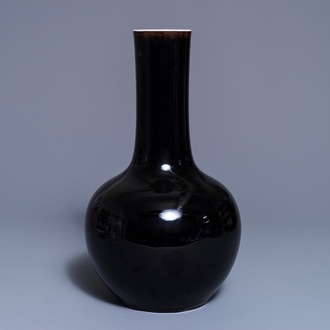 A Chinese mirror-black-glazed bottle vase, Kangxi mark, 19th C.