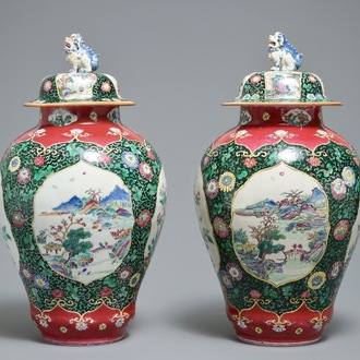 A pair of Chinese famille rose black-ground vases and covers, Yongzheng