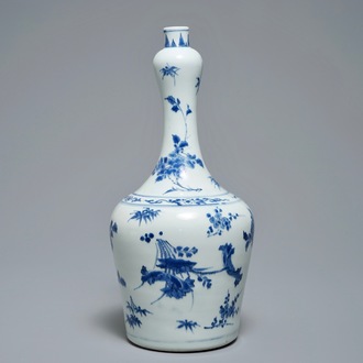 A Chinese blue and white bottle vase with floral design, Transitional period