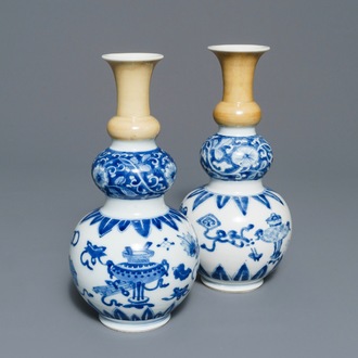 A pair of Chinese blue and white with cafe-au-lait triple gourd vases, Kangxi