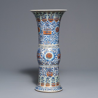 A clobbered Chinese blue and white 'gu' beaker vase, Kangxi