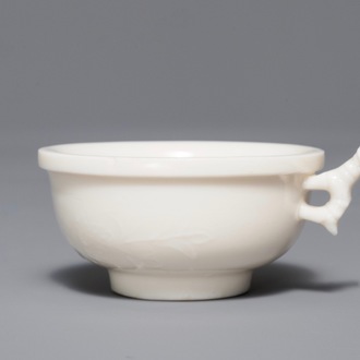 A Chinese Dehua blanc de Chine cup with applied design, Kangxi