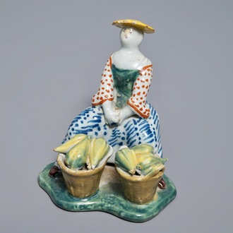 A polychrome Dutch Delft model of a melon seller, 18th C.