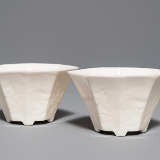 A pair of Chinese Dehua blanc de Chine wine cups with anhua design of horses, Transitional period