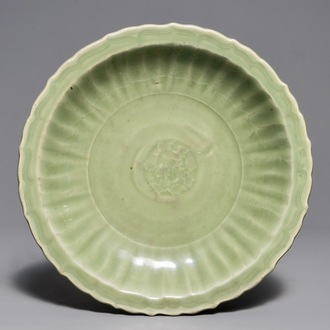 A Chinese Longquan celadon dish with underglaze design, Ming