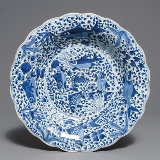 A lobed Chinese blue and white dish with fish, Kangxi