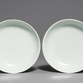 A pair of Chinese pale celadon anhua-decorated plates, Qianlong mark, 19/20th C