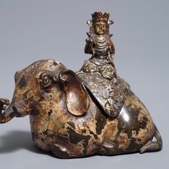 A Chinese bronze incense burner modelled as an elephant with female rider, Ming