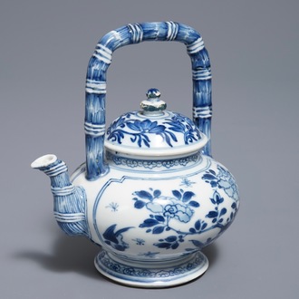 A Chinese blue and white gate-handled teapot and cover, Kangxi