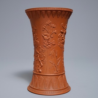 A Chinese Yixing stoneware beaker vase with applied floral design, Kangxi