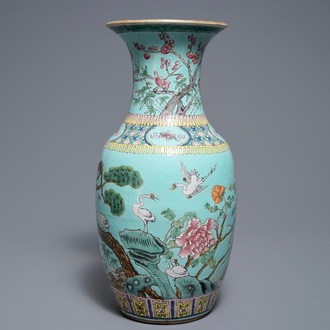 A Chinese famille rose turquoise ground vase, 19th C.