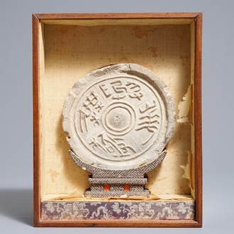 A Chinese earthenware roof-tile end with calligraphy, Han