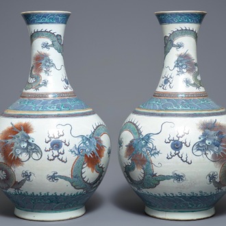 A pair of large Chinese doucai 'dragon' bottle vases, tianqiu ping, Qianlong mark, 19th C.