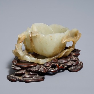 A Chinese lotus-shaped jade libation cup on stand, 18/19th C.
