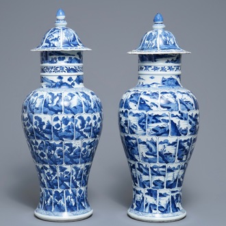 A pair of Chinese blue and white vases and covers with landscape panels, Kangxi