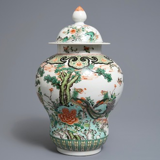 A Chinese famille verte vase and cover with birds and phoenixes, 19th C.
