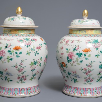 A pair of Chinese famille rose vases and covers with flowers and insects, 19th C.