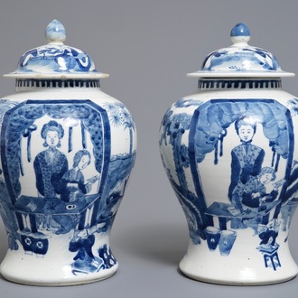 A pair of Chinese blue and white vases and covers, Kangxi mark, 19th C.