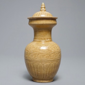 A Chinese brown-glazed vase and cover with floral anhua design, Song or later