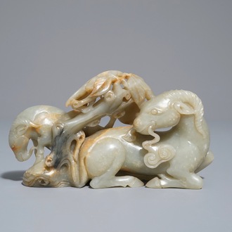 A Chinese celadon and russet jade 'rams' group, 18/19th C.