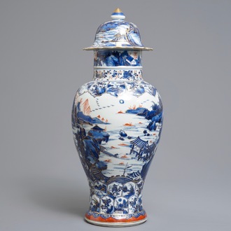 A Chinese clobbered blue and white vase and cover with landscape design, Kangxi