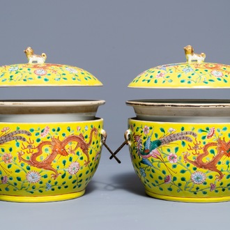 A pair of Chinese famille jaune tureens and covers with dragons and phoenixes, 19th C.